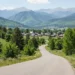 A scenic road through mountains near a small town